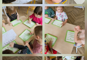 dzieci malują palcami po kaszy na tackach